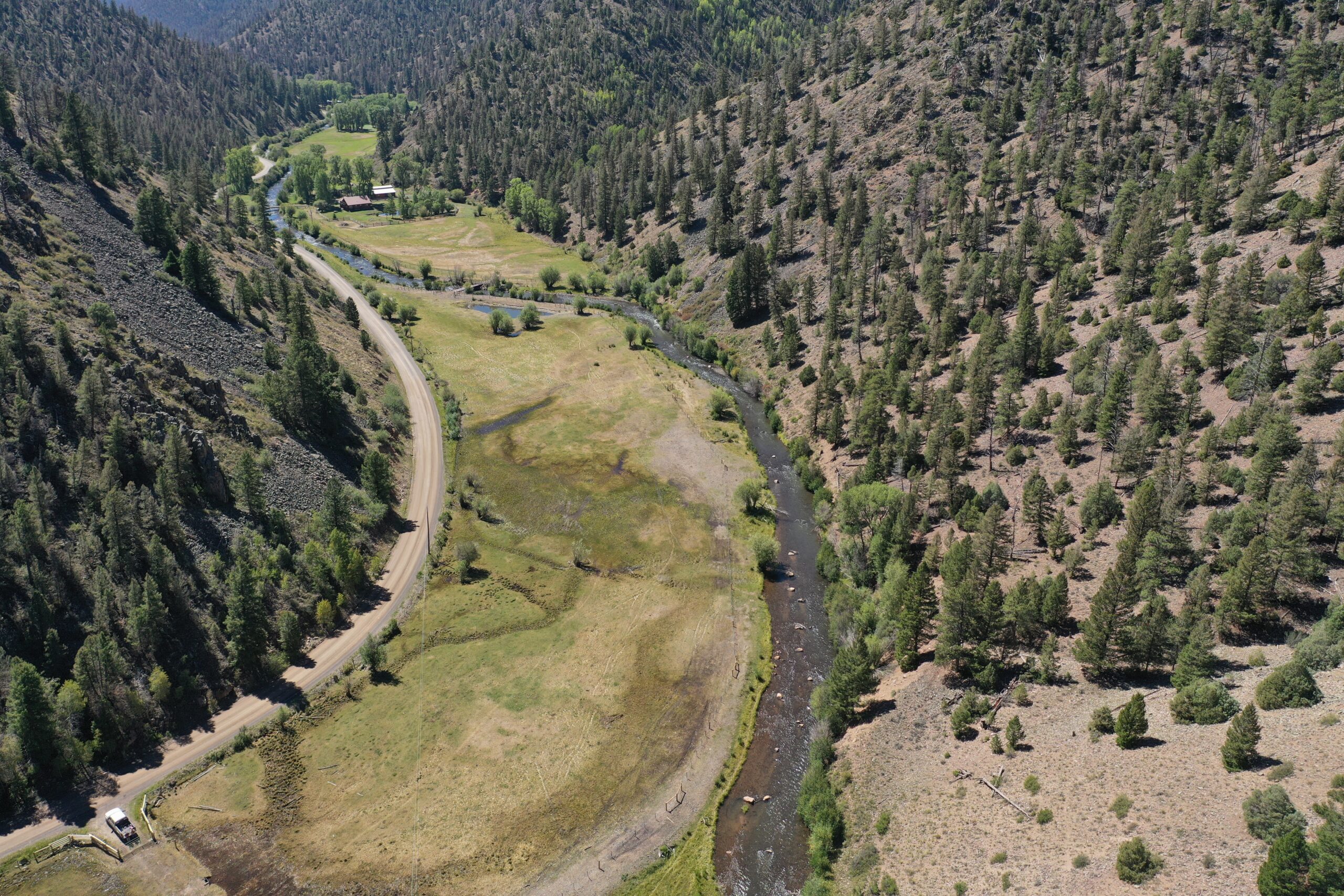 This multi-phase, multi-benefit project is improving irrigation efficiency, wildlife habitat, and watershed health on Cebolla Creek, a tributary to the Gunnison River located in Colorado’s Powerhorn Valley. A local landowner partnered with the USDA Natural Resources Conservation Service, U.S. Fish and Wildlife Partners for Fish and Wildlife, and Trout Unlimited to install a new headgate, construct a riparian fence, and restore 1,800 feet of Cebolla Creek to support a healthier riverine ecosystem and more productive agriculture. The fence allows the landowner to schedule grazing near the sensitive stream banks to encourage recovery of riparian vegetation. Improved grazing management supports the stream channel restoration  aspects of this project, including recovering riparian vegetation, reducing erosion, and strengthening channel stability, all of which is improving water quality, riparian habitat, and aquatic habitat while better irrigating pasture on the property. This project demonstrates how upgraded ranch infrastructure coupled with managed irrigation, scheduled grazing techniques, and designed habitat improvements can support both thriving agriculture and healthier ecosystems in the Colorado River Basin.