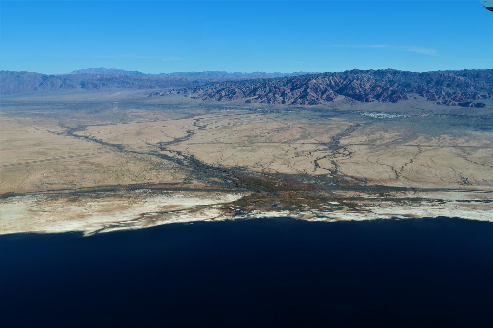 Bombay Beach Wetlands on the coast of the Salton Sea, backdropped by the Orocopia and West Chocolate Mountains